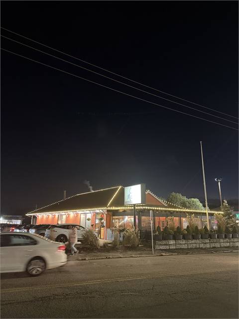 Commercial building with holiday lights at night