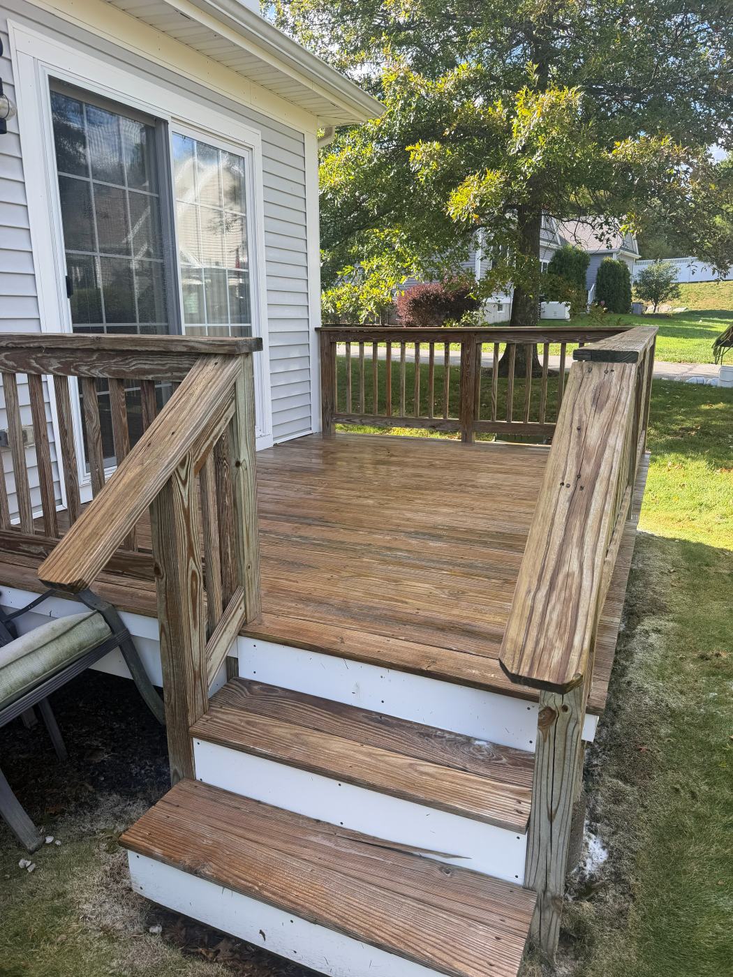 The same deck and stairs with the wood color restored