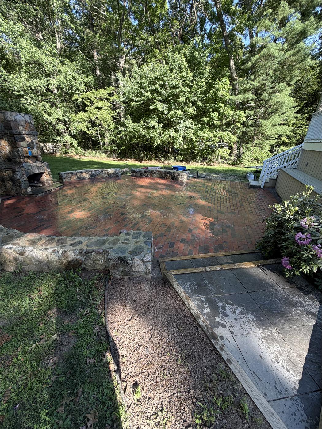 Dirty patio beside a drained pool
