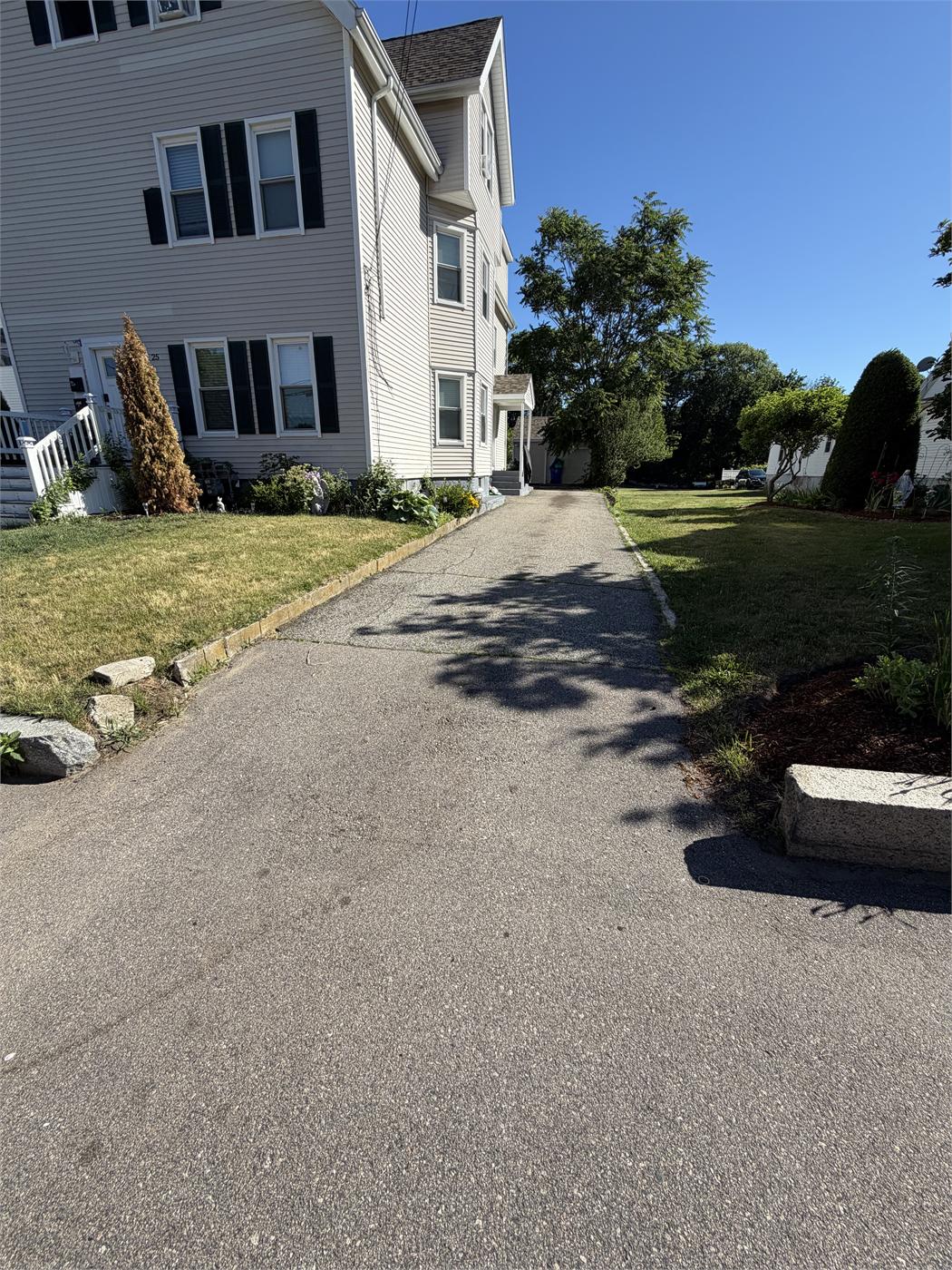Worn, light gray driveway